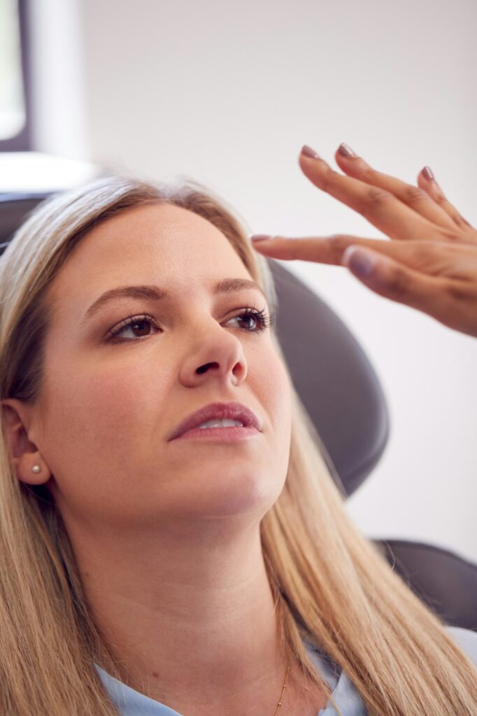 Beautician Or Doctor Preparing Female Patient For Botox Injection