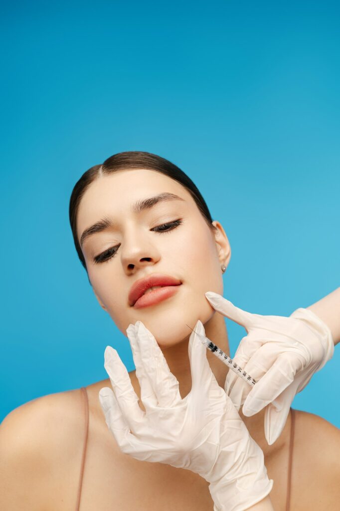 Pretty woman getting beauty injection in chin. Beauty care, anti aging procedures, plastic surgery